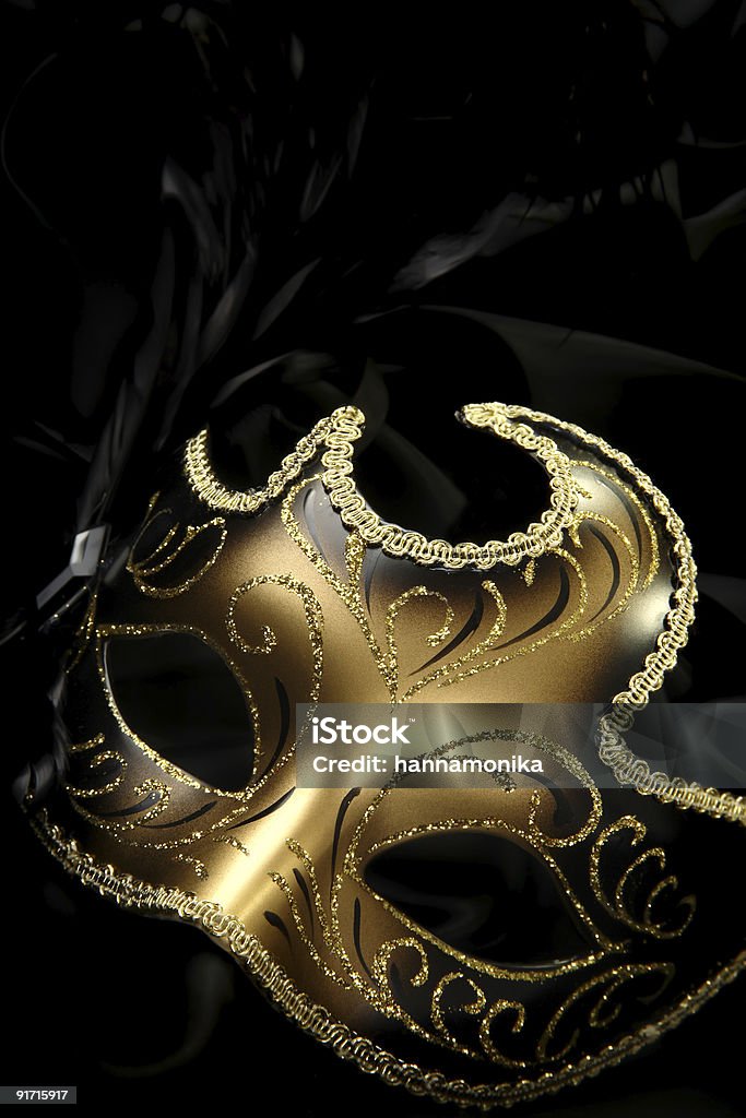 Gold carnival mask against black background ornate carnival mask over black background Mask - Disguise Stock Photo