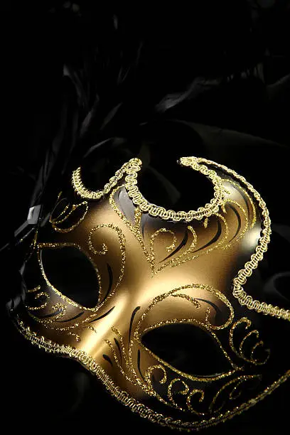 ornate carnival mask over black background