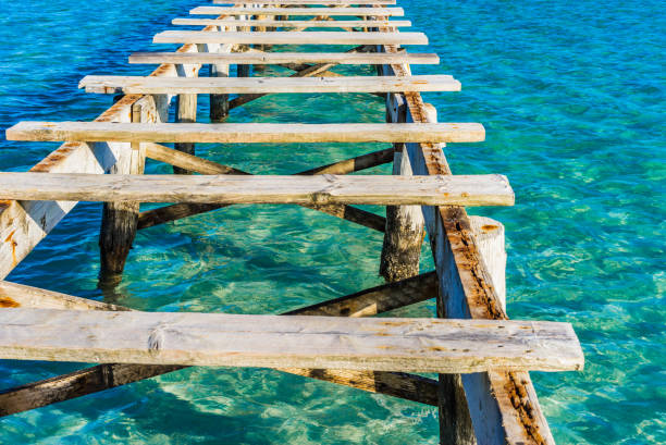 istock Damaged old wooden pier, close-up 917159282