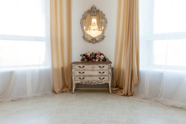 istock White chest of drawers in white interior 917159478