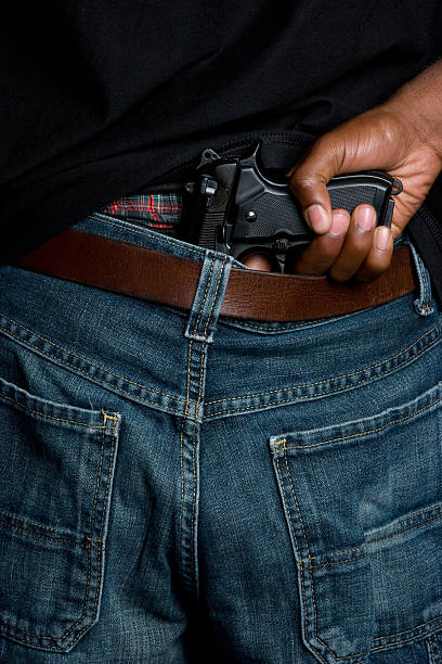 istock Gangster with gun in belt 91716145