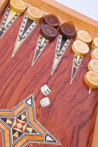 istock White dices falling on wooden handmade backgammon board isolated 91716243