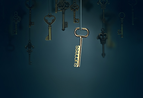 A conceptual image with hanging keys and one shining key
