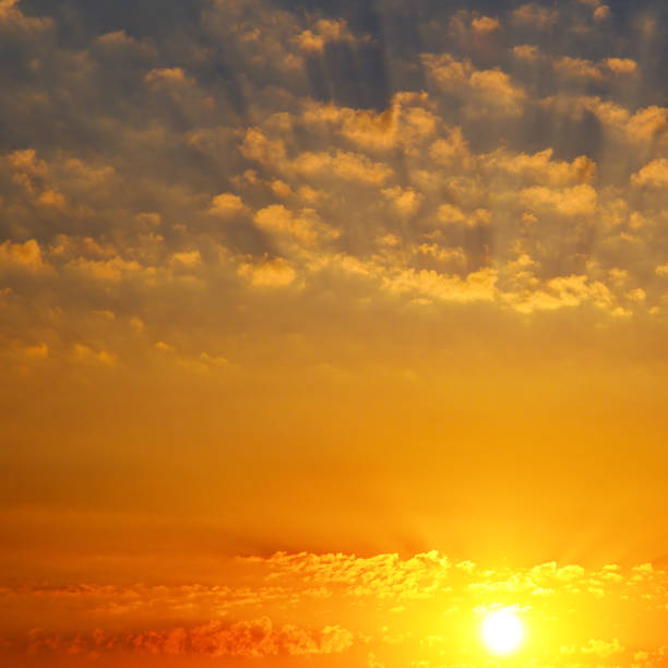 istock Cloudy sky and bright sunrise over the horizon. 917163396