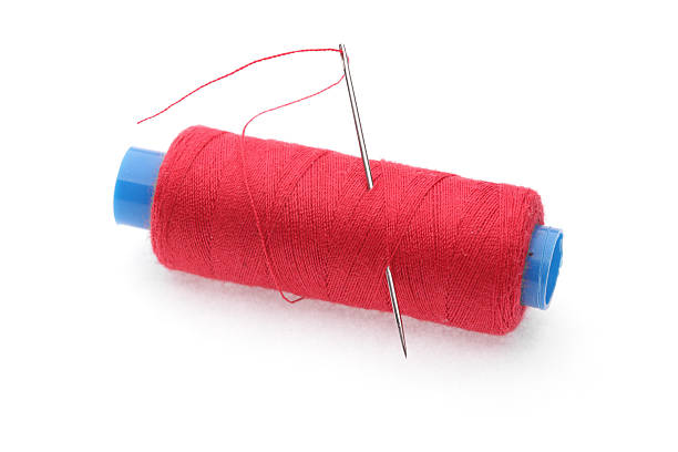 istock The coil of red threads with needle 91716476