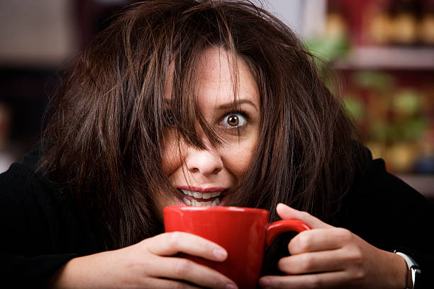Coffee-Crazed Woman  caffeine stock pictures, royalty-free photos & images