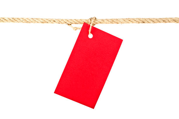 istock Red lable on a rope isolated on white background, closeup 917167268