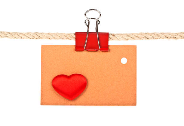 istock Brown label with heart on a rope isolated on white background, closeup 917167274