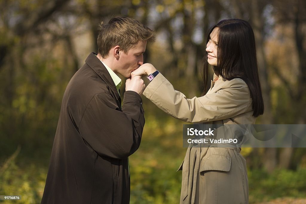Young romantic man kissing girls hand  Adult Stock Photo