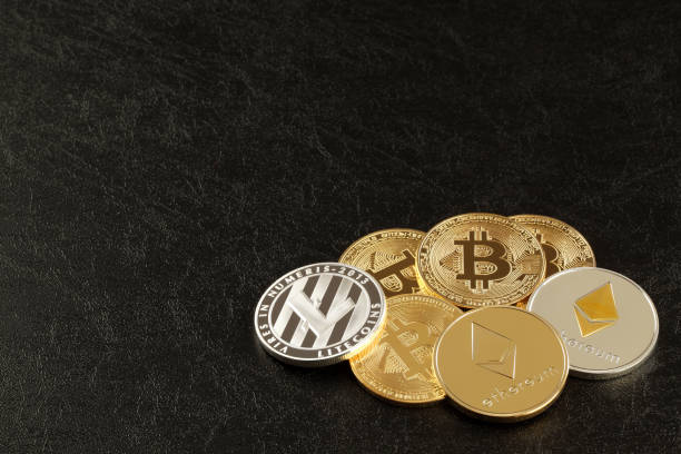 Close up shot of three main cryptocurrencies; bitcoin, ethereum and litecoin in dark surface. Tokyo,Japan-february 11 ,2018: Studio shot of  ethereum, litecoins, Bitcoin, on black background.Digital virtual currency litecoin stock pictures, royalty-free photos & images