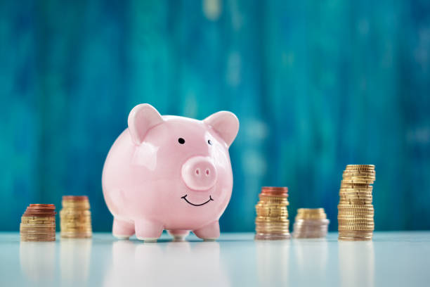 istock piggy bank with stacked coins 917169770
