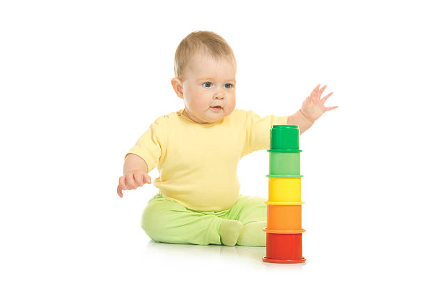 istock Small baby with a toy pyramid isolated 91716979