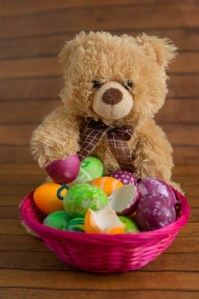 istock Collection of easter eggs in basket and soft toy 917170044