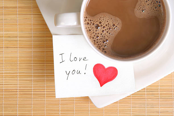 love note with a cup of coffee stock photo