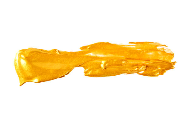 istock Strokes of golden paint isolated on white background 917173888
