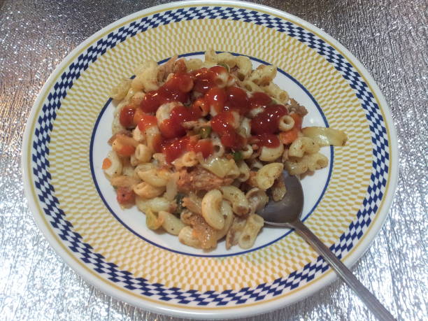 Pasta penne macaroni with tomato bolognese sauce served in ceramic pla