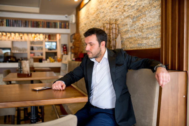 istock Businessman is sitting in restaurant 917178028