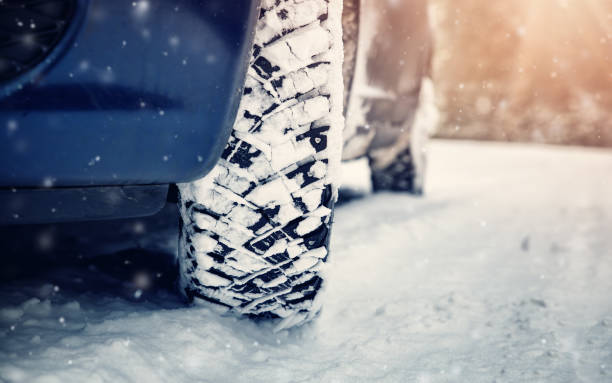 istock Car tires on winter road 917178032