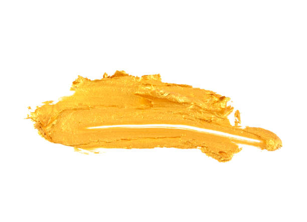 istock Strokes of golden paint isolated on white background 917185492