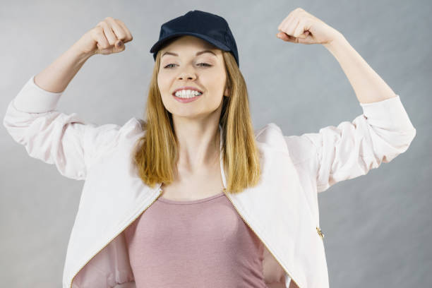 istock Young woman showing her arm muscles 917188216