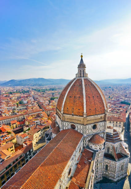 Dome of Florence Cathedral and the Florence city in the background on a sunny day. stock photo