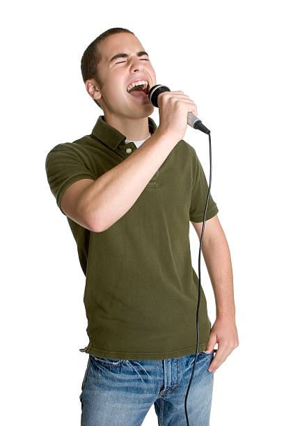 istock Teenage boy with eyes shut singing into microphone 91718973