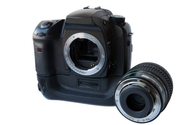 Digital SLR camera with lens and vertical battery grip over white background