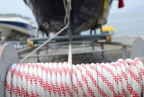 Mooring and seafaring ropes for boat anchoring on wooden ferry deck