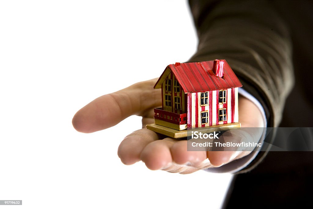 woman hand holding small house - real state concept  Sale Stock Photo