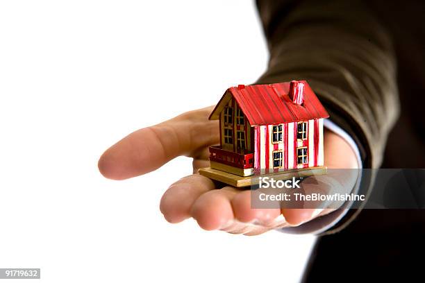 Woman Hand Holding Small House Real State Concept Stock Photo - Download Image Now