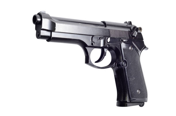 istock Used black metal 9mm pistol gun on white background 917199166