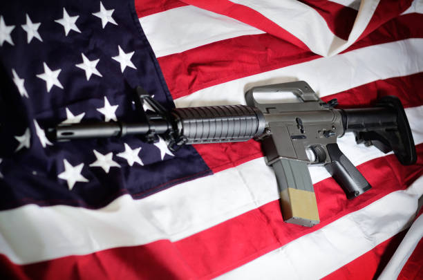 istock Flag of the USA with rifle 917199310