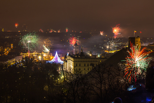 Vilnius, Lithuania - January 01, 2017: Beutifull view to the main firework, at New Year night to Cathedral Square and belfry tower and Cathedral of St. Stanislaus and St. Vladislav, from hill of three crosses