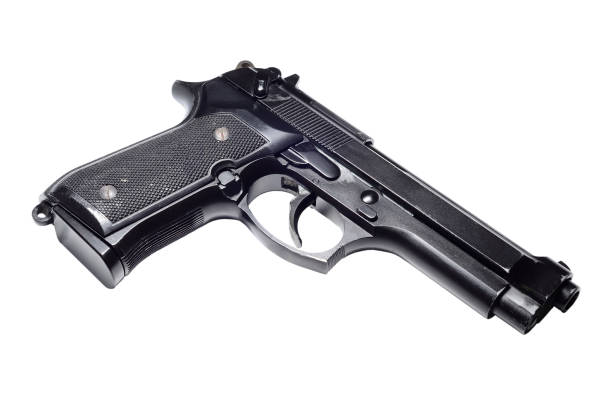istock Used black metal 9mm pistol gun on white background 917202322