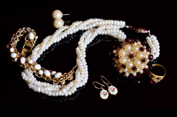 Pearl necklace on wooden background