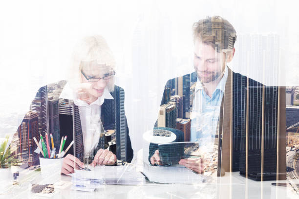 istock Two Businesspeople Calculating Bills 917203030