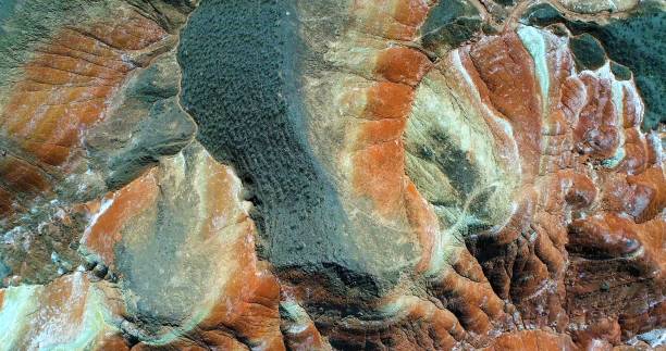 Multicolored pattern created by nature World’s most beautiful places. Aerial view on Rainbow mountains in Zhangye National Geopark displaying multicolored pattern. Gansu province, China. zhangye danxia geopark china stock pictures, royalty-free photos & images