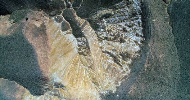Amazing pattern created by nature Aerial view on sandstone hills covered with sparse vegetation in Zhangye Danxia landform geological park in Gansu province, China. zhangye danxia geopark china stock pictures, royalty-free photos & images