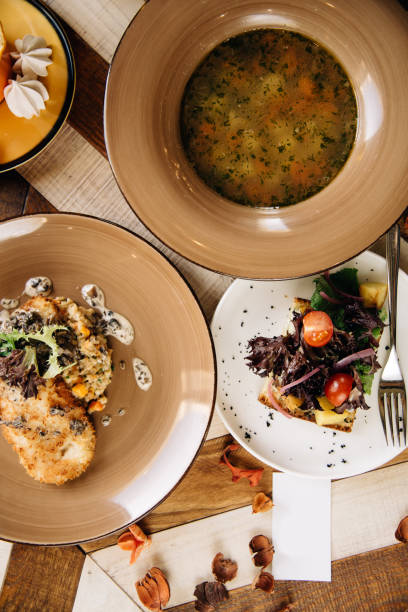 istock Set dinner of three courses. Chef's specialty presented in restaurant on served table. Clouse up. Rustic style 917203496