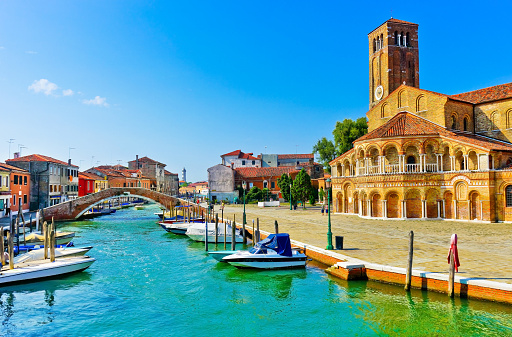 Colorful Venetian houses along the canal at the Islands of Murano in Venice.