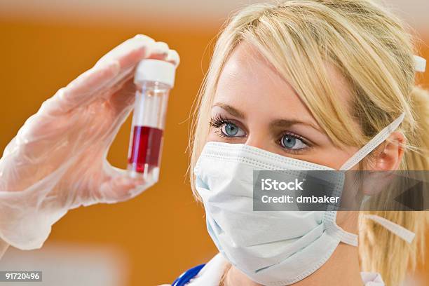 Woman Doctir Or Nurse Analyzing Blood Sample Stock Photo - Download Image Now - Adult, Adults Only, Blood