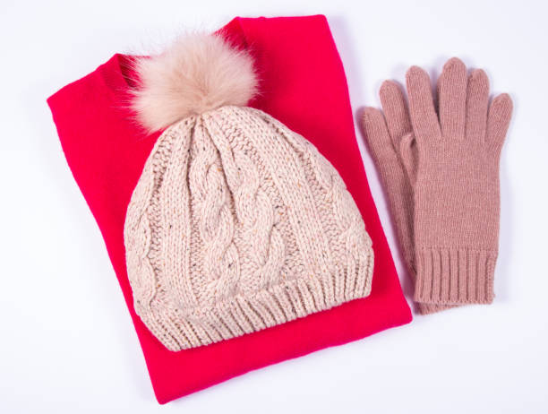istock Wool hat, sweater and gloves for winter weather on a white background. 917206100