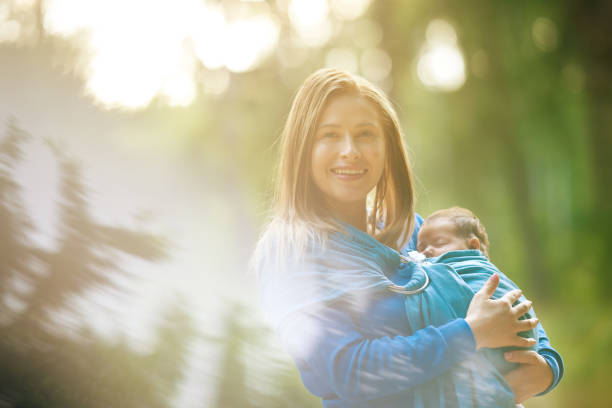 happy young mother walking with her baby girl and enjoying summer day.photo taken in nature.
