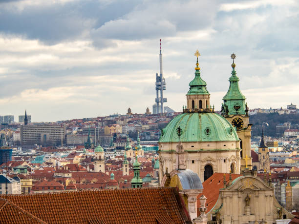 Church of St. Nicholas, and Zizkov TV Tower, Prague Church of St. Nicholas, and Zizkov TV Tower, Prague, Czech Republic st nicholas church prague stock pictures, royalty-free photos & images