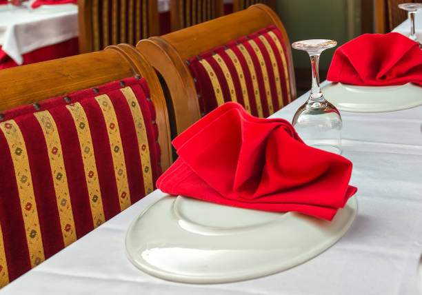istock Glasses and plates on dinner table in restaurant 917207216