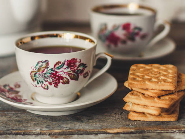 istock tea-drinking with cookies - on a wooden table 917210274