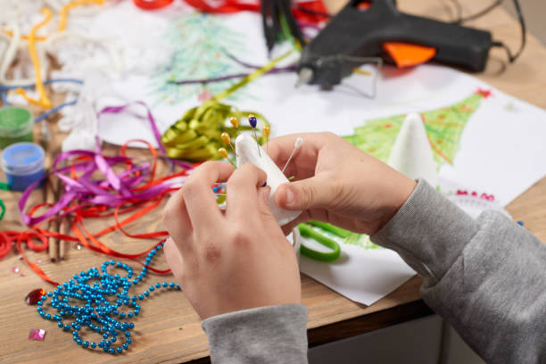 istock Child make crafts and toys, handmade concept. Artwork workplace with creative accessories. 917210986