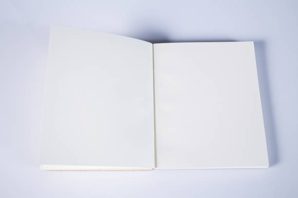 istock White paper in notebook isolated on white background, Close up 917211210