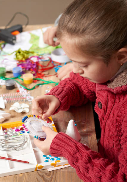 istock Child make crafts and toys, handmade concept. Artwork workplace with creative accessories. 917211618