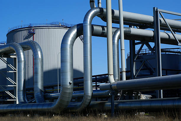 istock industrial pipelines on pipe-bridge against blue sky 91721541